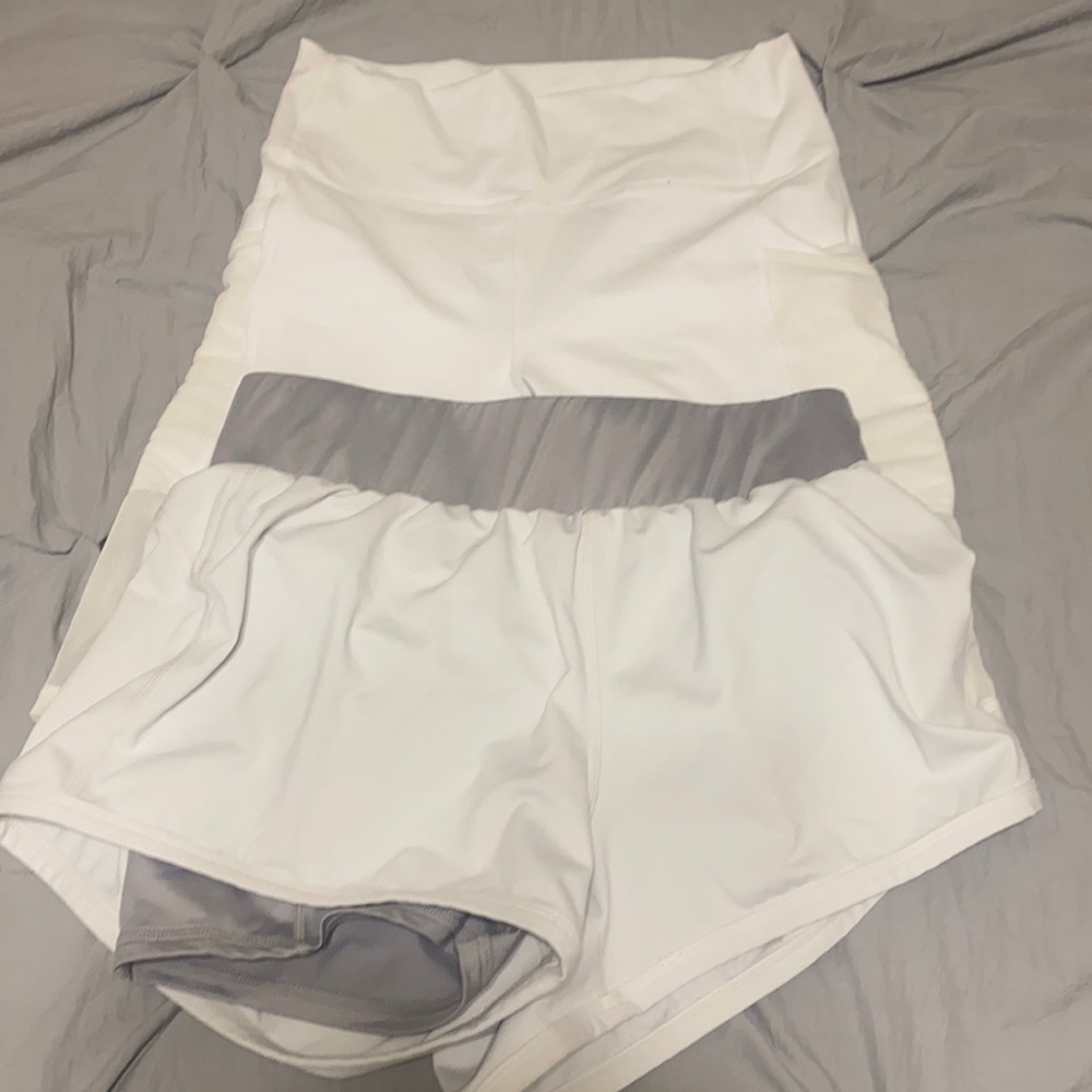 White biker shorts and white running shorts with grey liner.